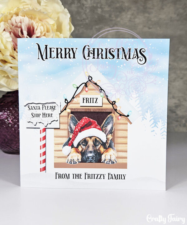personalised dog in santa hat in kennel merry christmas card