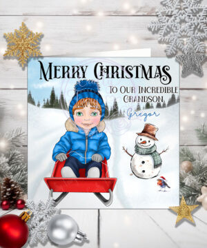 personalised young boy on sledge in snow christmas card for son grandson
