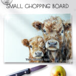 personalised parent cow and calf glass chopping board or worktop protector