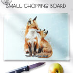 personalised parent fox & cub glass chopping board or worktop protector