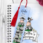 personalised daisy dairy cow & books metal bookmark