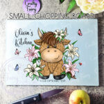 personalised highland cow with pink lily flowers glass chopping board or worktop protector