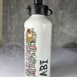 personalised highland cow with pink lily flowers 600ml water bottle