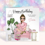 personalised female book lover reader in pink jumper on armchair birthday card