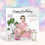 personalised female book lover reader in pink jumper on armchair birthday card