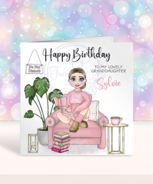 personalised female book lover reader in pink jumper on armchair birthday card