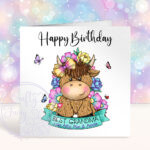 personalised highland cow with bright flowers & banner birthday card