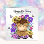 personalised highland cow with sunflowers & purple flowers birthday card