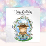 personalised highland cow in wellies with daisy flowers birthday card