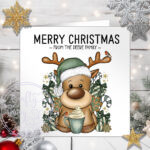 personalised reindeer in green santa hat with hot chocolate christmas card