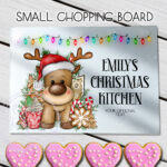 personalised reindeer in red santa hat christmas glass chopping board or worktop protector