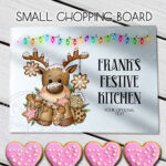personalised iced reindeer and cookies christmas glass chopping board or worktop protector