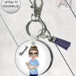 personalised midwife / birth attendant / maternity nurse with baby keyring / bag tag