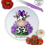 personalised friesian cow and purple flowers glass chopping board