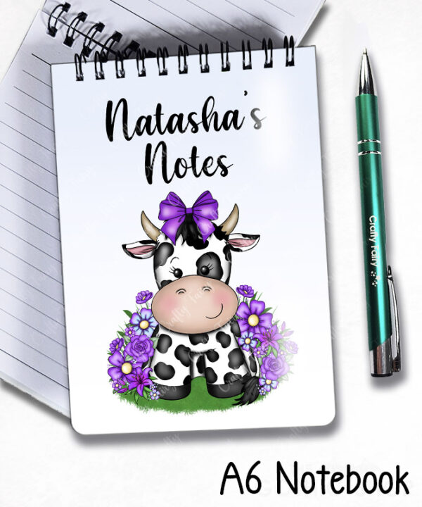 personalised friesian cow and purple flowers notebook